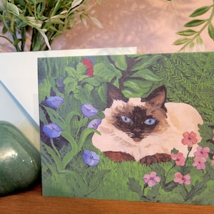 Siamese Cat Laying in a Garden Greeting Card, Siamese Cat Send a Message With this Artistic Card