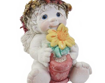 Figura de ángel querubines Dreamsicles de 1995 con girasol en maceta.