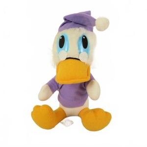 May include: A plush Donald Duck toy in a seated position. The toy is wearing a purple nightcap with a white pom-pom, a purple shirt, and has a yellow beak and feet. The duck has large blue eyes and white fur around its face.