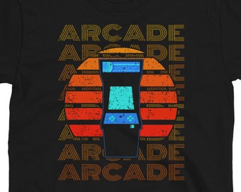May include: Black t-shirt with a retro arcade game graphic and the word "ARCADE" repeated in a vintage font.