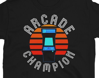 May include: Black t-shirt with a retro arcade game graphic and the text "Arcade Champion" in a white outline.