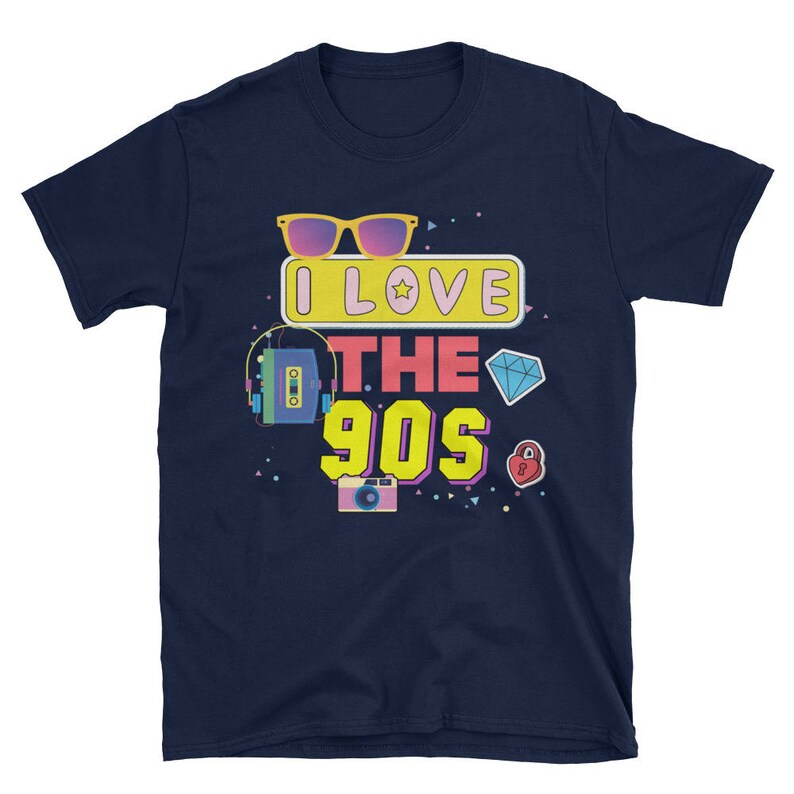 May include: Navy blue t-shirt with a graphic design featuring a pair of sunglasses, a cassette tape, a diamond, a heart, and a camera. The text on the shirt reads "I Love The 90s".