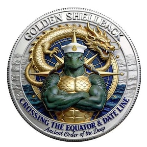 May include: A circular silver-toned commemorative coin featuring a central green turtle wearing a white sailor cap with arms crossed. Behind the turtle is a gold dragon and a blue compass rose. Text reads GOLDEN SHELLBACK CROSSING THE EQUATOR & DATE LINE.