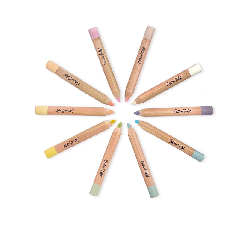 May include: A set of ten coloured pencils arranged in a circular pattern. Each pencil has a natural wood barrel with a coloured tip and eraser. The pencils are labelled with the text "Cotton Twist".