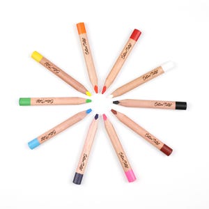 May include: A collection of ten colored pencils arranged in a circular pattern. Each pencil has a natural wood barrel and a colored tip and end. The text "Cotton Twist" is printed on each pencil.