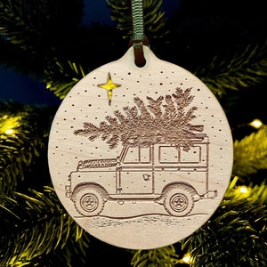Classic Land Rover and Christmas tree laser etched bauble
