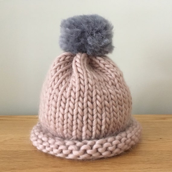 pink bobble hat baby