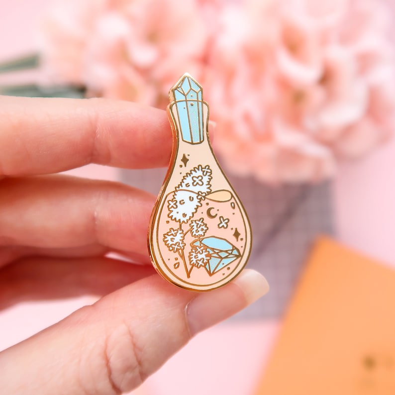 Hard enamel potion pin close-up