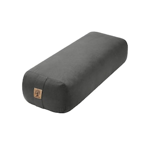 May include: A dark gray yoga bolster with a brown label that says "Manduka".