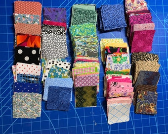250 2 1/2 inch square quilting fabric.  Free shipping