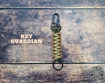 Portachiavi con clip per fucile in paracord terroso realizzato a mano