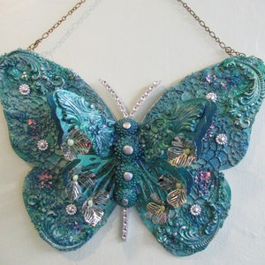 Mixed media, wall hanging, butterfly ornament.