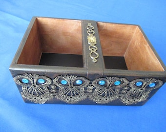 Wooden box with handle.