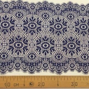 May include: Navy blue lace trim with a delicate floral pattern. The trim is approximately 40 inches long and has a scalloped edge.