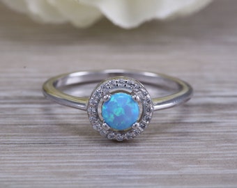 solid sterling silver ring further 18ct rose gold plated Very sparkly and fiery Opal and cubic zirconia set dress ring