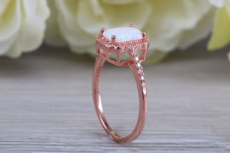 solid sterling silver ring further 18ct rose gold plated Very sparkly and fiery Opal and cubic zirconia set dress ring