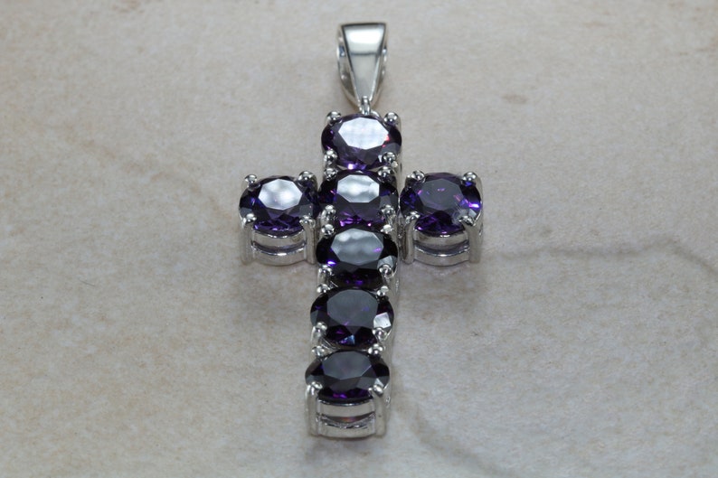 Stone set cross. Very large and chunky sterling silver cross set with Amethyst cubic zirconias