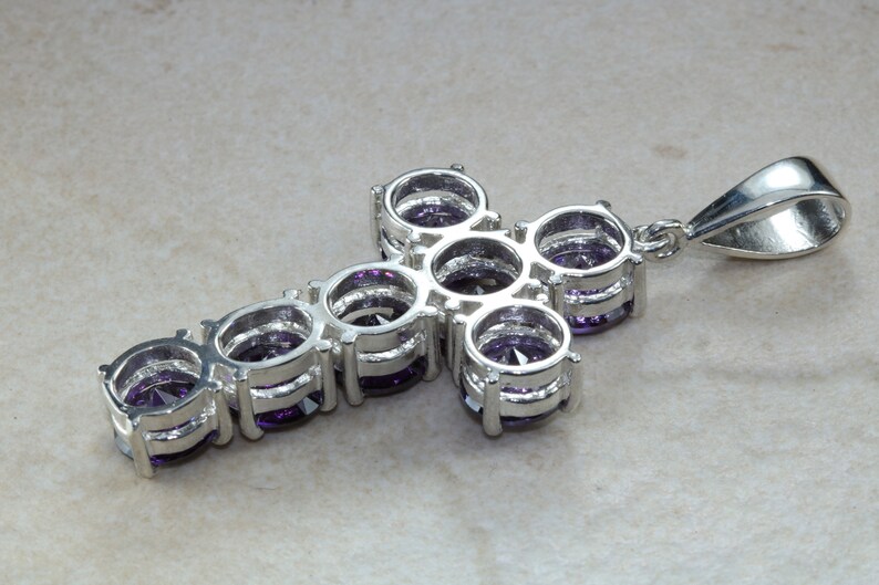 Stone set cross. Very large and chunky sterling silver cross set with Amethyst cubic zirconias