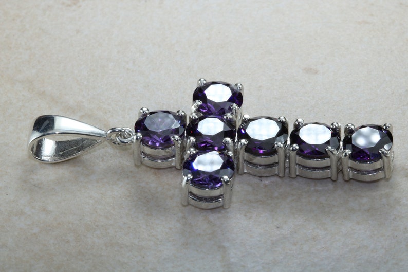 Stone set cross. Very large and chunky sterling silver cross set with Amethyst cubic zirconias