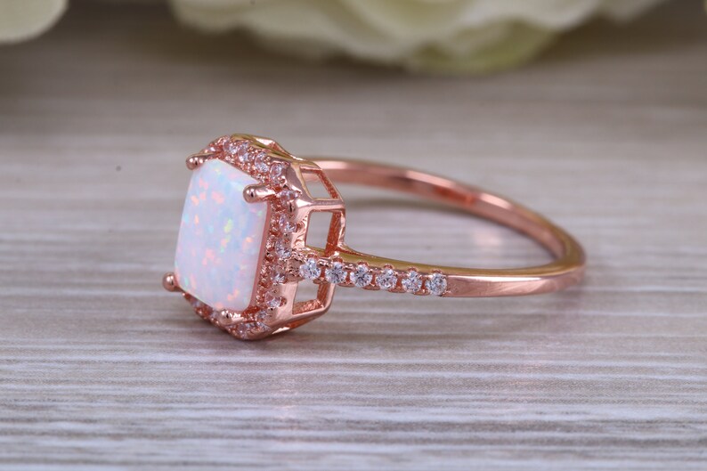 solid sterling silver ring further 18ct rose gold plated Very sparkly and fiery Opal and cubic zirconia set dress ring