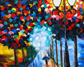 May include: An impressionistic painting of a street scene with a person holding an umbrella. The artwork features a vibrant color palette, with trees and foliage in shades of red, blue, yellow, and green. A black lamppost stands in the center.