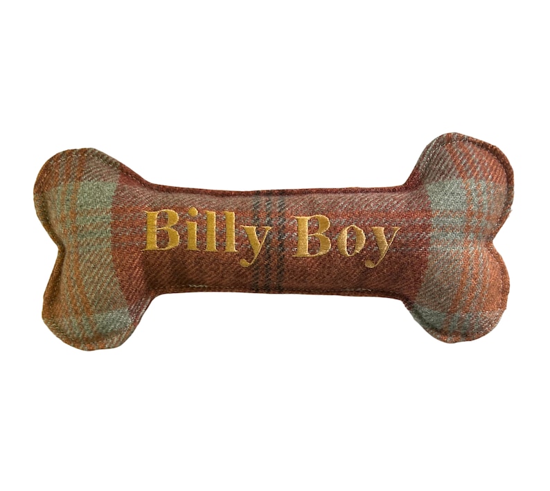 Handmade orange warm spice tartan bone toy. personalised name embroidery in gold thread.