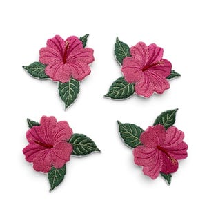 May include: Four embroidered hibiscus flower patches featuring vibrant pink petals with detailed stitching and dark green leaves. Each patch displays a prominent central stamen and textured foliage, designed for application onto fabric surfaces.