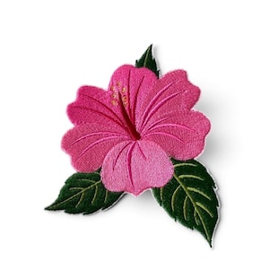 May include: An embroidered patch featuring a vibrant pink hibiscus flower with five rounded petals and a central stamen, accompanied by two dark green leaves with visible stitching details and a white border edge on a plain white background.