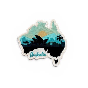 May include: Embroidered patch shaped like Australia, depicting the Sydney Opera House, a kangaroo, and a palm tree silhouette. The patch has a teal and blue background with a yellow sun and the word "Australia" in cursive.