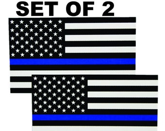 May include: Set of two reflective black and white American flag decals with a blue stripe. The decals feature a thin blue line across the middle of the flag, representing support for law enforcement.