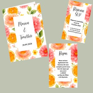 May include: Wedding invitation suite featuring watercolor illustrations of orange slices and pink flowers. The main invitation card displays the names "Marion & Timoth&eacute;e" and the date "30.09.2028". Additional cards include RSVP and reception details.