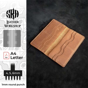 May include: A brown leather wallet with multiple card slots and a billfold. The wallet is open and laid flat on a dark surface. The wallet is made from a single piece of leather and has been stitched together. The stitching is visible on the outside of the wallet. The wallet is labeled "A4 Letter" and includes instructions for making the wallet using a 1mm round punch and 4, 5, and 6mm punches.