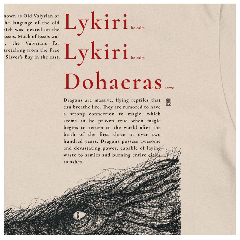 May include: Cream-coloured t-shirt with red text: "Lykiri be calm" and "Dohaeras serve." A black and white illustration of a dragon's eye and scales is below the text. The shirt also has text about dragons.