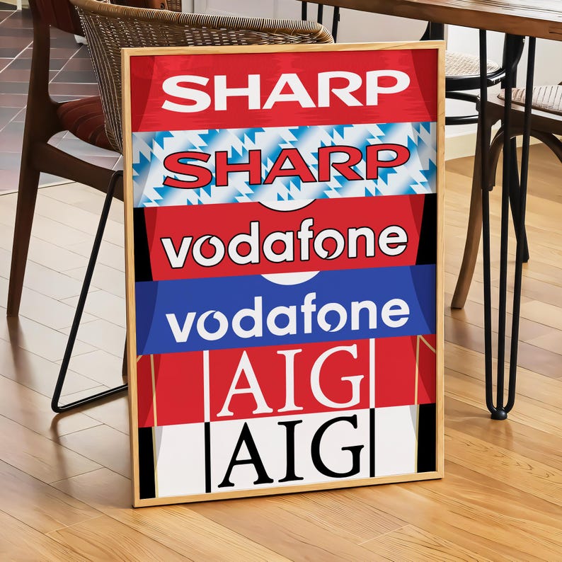 May include: A framed poster with a red, white, and blue color scheme. The poster features the logos of several companies, including Sharp, Vodafone, and AIG.
