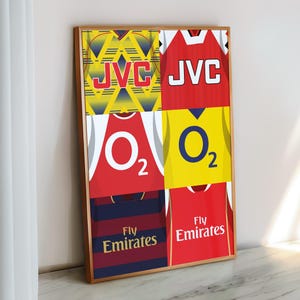 May include: A collage of six different Arsenal football jerseys, featuring various sponsors like JVC, O2, and Fly Emirates. The jerseys are arranged in a grid pattern, with a yellow and blue jersey in the top left corner, a red jersey in the top right corner, a red jersey in the middle left, a yellow jersey in the middle right, a navy blue jersey in the bottom left, and a red jersey in the bottom right.