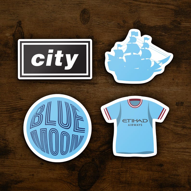 May include: Four blue and white stickers with different designs. The first sticker says "city" in black text. The second sticker is a silhouette of a ship. The third sticker says "BLUE MOON" in a circular design. The fourth sticker is a blue soccer jersey with the text "ETIHAD AIRWAYS" on the front.