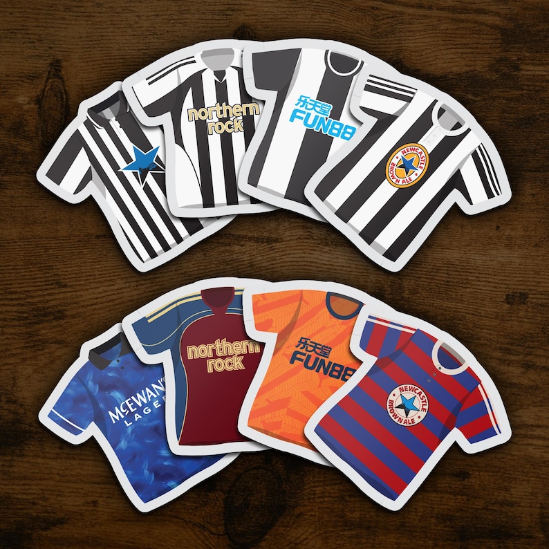 May include: A set of ten black and white football jersey-shaped coasters with various sponsors, including "northern rock" and "FUN88".