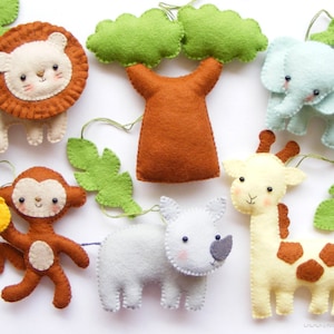 May include: A felt mobile with a brown tree, a yellow giraffe, a blue elephant, a brown monkey holding a yellow banana, a brown lion, and a gray rhinoceros. The mobile is decorated with green leaves.