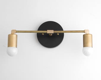 black and gold bathroom light