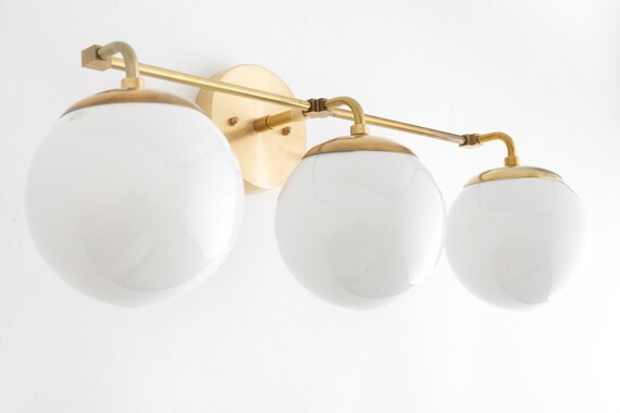 Brass globe clearance vanity light