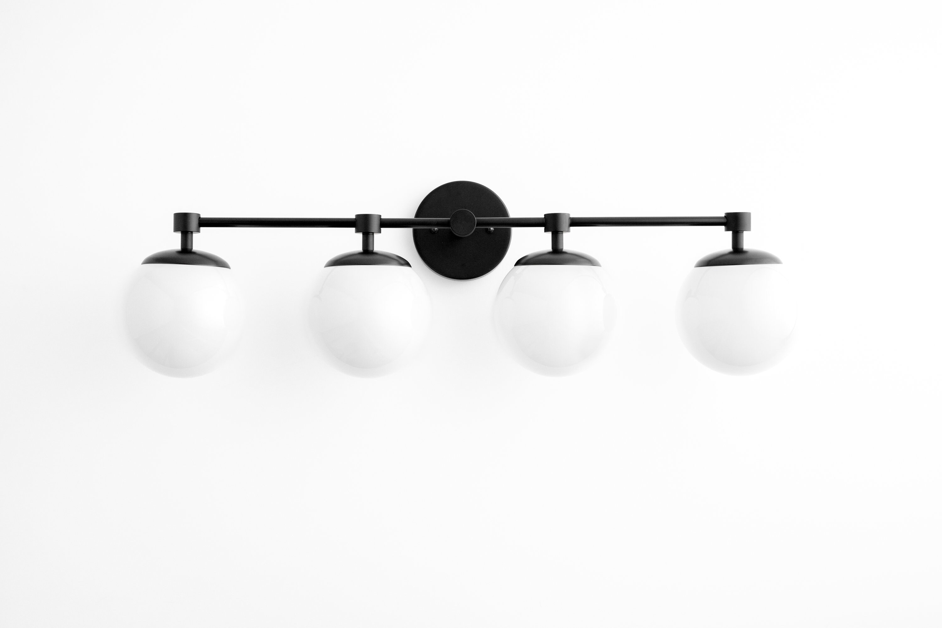 Matte black globe vanity light deals