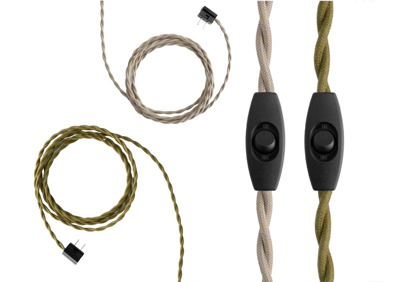May include: Two twisted fabric-covered electrical cords, one beige and one olive green, each featuring a black inline rocker switch with on and off markings and a two-prong plug connector at the end of the coiled cord sections.