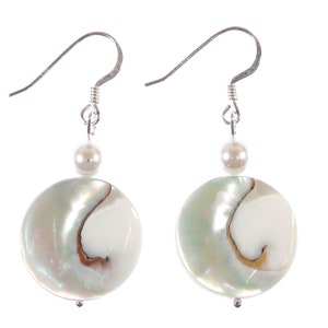May include: A pair of silver dangle earrings with a white pearl and a round, iridescent white shell bead.
