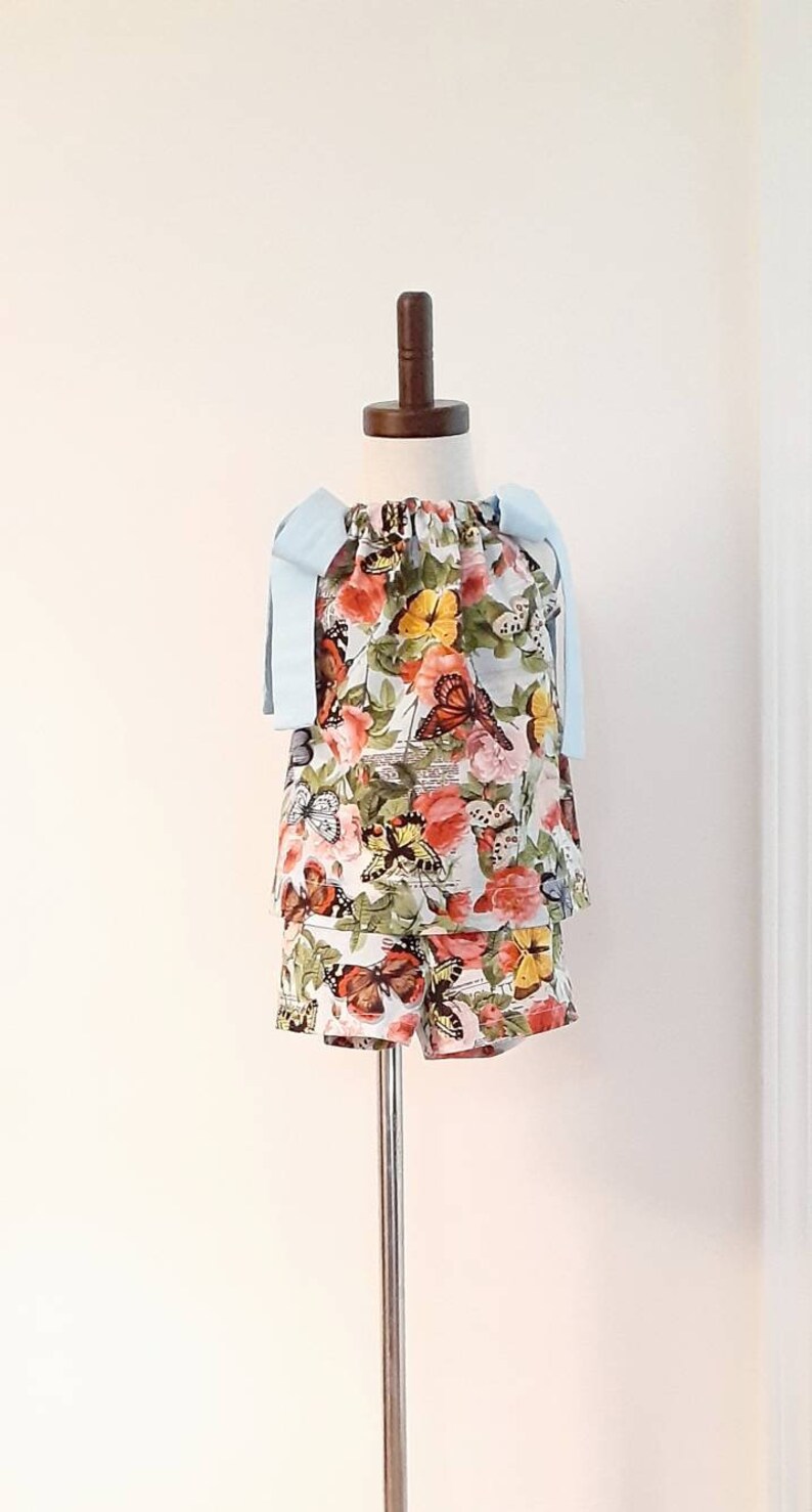 3 piece toddler top Size 2T. skirt and shorts set