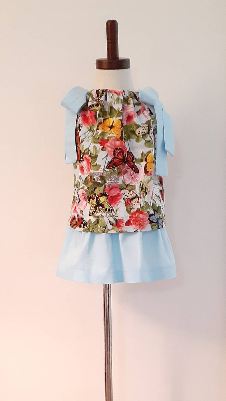 3 piece toddler top Size 2T. skirt and shorts set