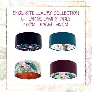 May include: Four large lampshades in black, teal, teal with a copper interior, and burgundy. Each cylindrical lampshade has a patterned interior with floral and animal designs. The text "EXQUISITE LUXURY COLLECTION OF LARGE LAMPSHADES 40cm - 50cm - 60cm" is at the top.