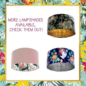 May include: Four lampshades are shown, each with a unique design. One is black with a jungle scene and a gold interior. Another is pink with a floral interior. The third is navy blue with a floral and bird design. The fourth lampshade has a jungle scene.