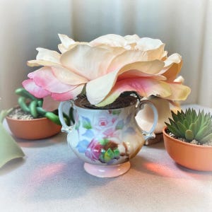 small vintage container floral arrangement
