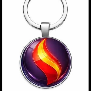 Puede incluir: Un llavero plateado con un colgante redondo con un diseño de llama. La llama es roja, naranja y amarilla sobre un fondo morado. El llavero tiene un anillo plateado.