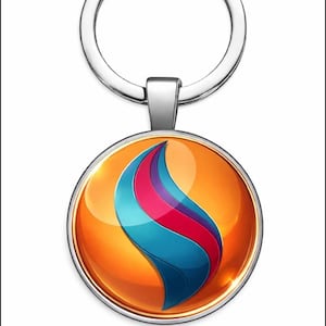 Puede incluir: Llavero plateado con un colgante circular. El colgante tiene un fondo naranja brillante y un diseño en forma de llama azul, rosa y morado. El llavero está unido al colgante.